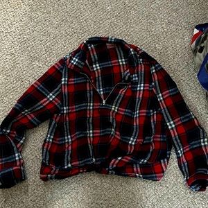 A X-Large along sleeve plaid shirt with sipper shows the girls